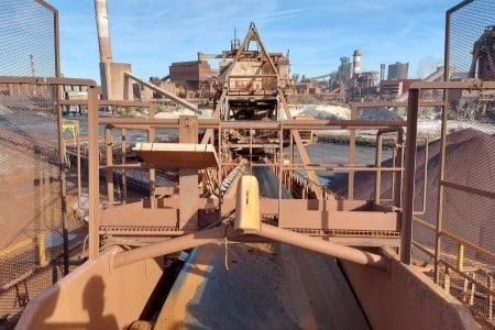 view of site with machine and conveyor belt